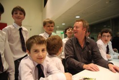 Howard with pupils from Guildford County School