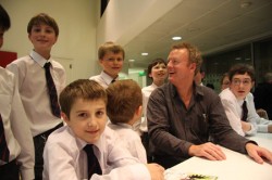 Howard with pupils from Guildford County School